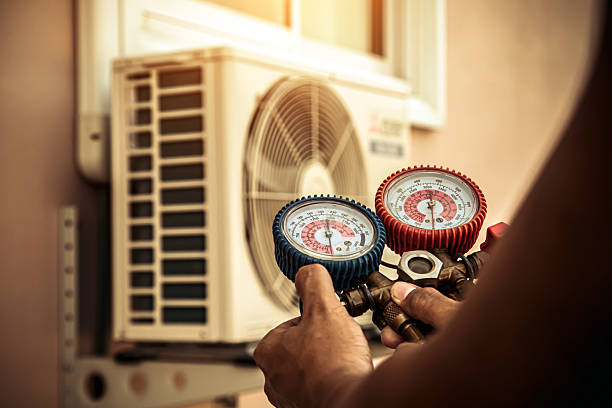 Professional Air Conditioning Service technician working in Michigantown, IN